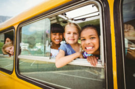 school children on a bus