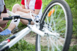 Damaged bike and injured bicycle rider that will need a Corpus Christi bicycle accident lawyer.