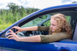 checking car mirror