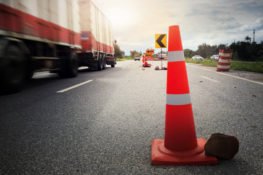 semi truck driving through a construction zone in Texas