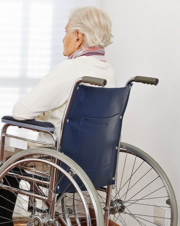 Sad elderly person in nursing home