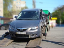 car being towed due to damage