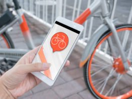 person viewing bike sharing program on their phone