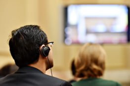 person listening to translation headset