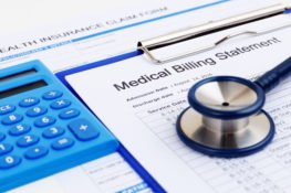 medical bills and records with calculator