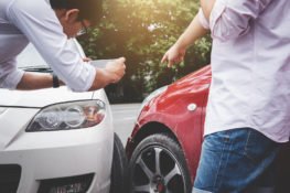 Two Drivers Man Arguing After A Car Traffic Accident Collision