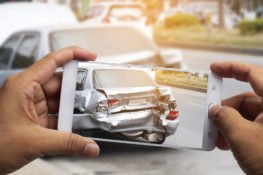 taking picture of damaged vehicle