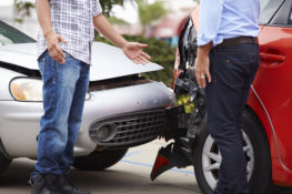 two men discussing after an accident