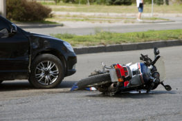 motorcycle laying on the road after accident