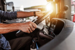 CDL Commercial truck driver inside his truck