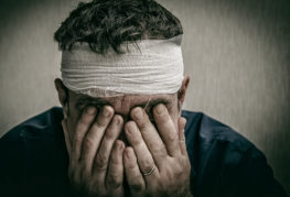 A man is stressed after having head injury in a car accident