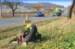 crucifix on the side of a rural road