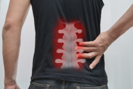 man suffering from a back injury
