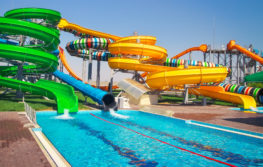 empty waterpark with green and yellow slide