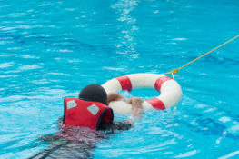 child being rescued from drowning