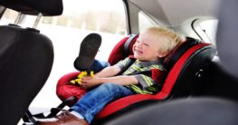 a child on a carseat