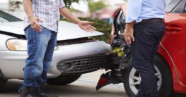 Men negotiating after car accident