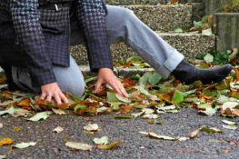 man trying to get up after slipping and falling
