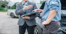 men negotiating after an accident