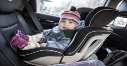 a child on a car seat