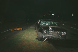 wrecked black car