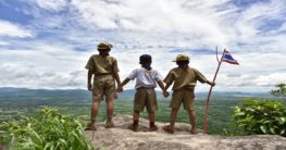 three boy scouts looking at the top view