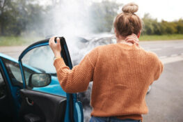 woman experiencing a neck pain after a car accident